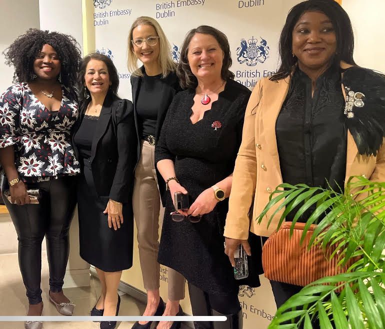 Women standing and smiling