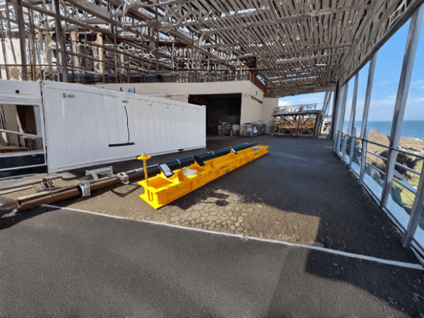 Yellow industrial mining equipment on a construction site.