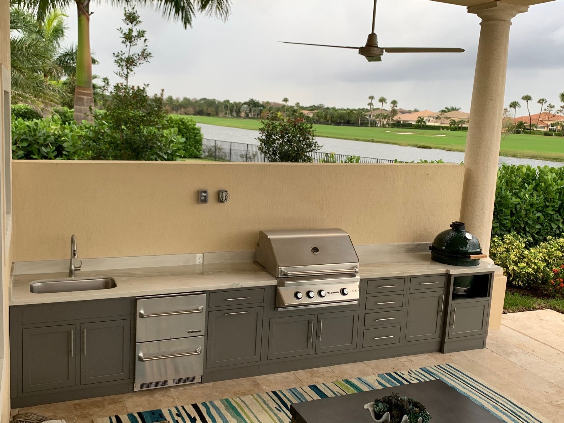 Challenger Designs straight run custom outdoor kitchen with big green egg textured grey glimmer with shaker doors