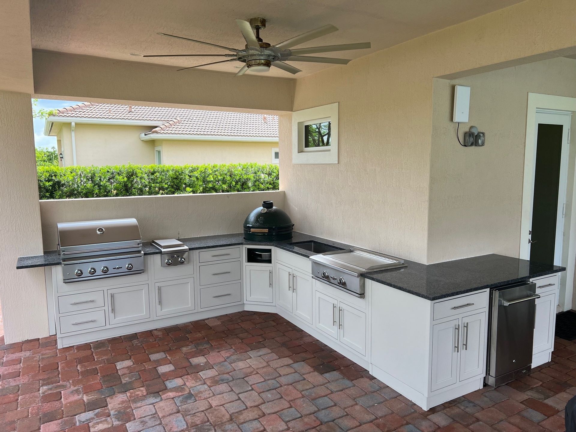 Challenger Designs custom outdoor kitchen white with shaker doors