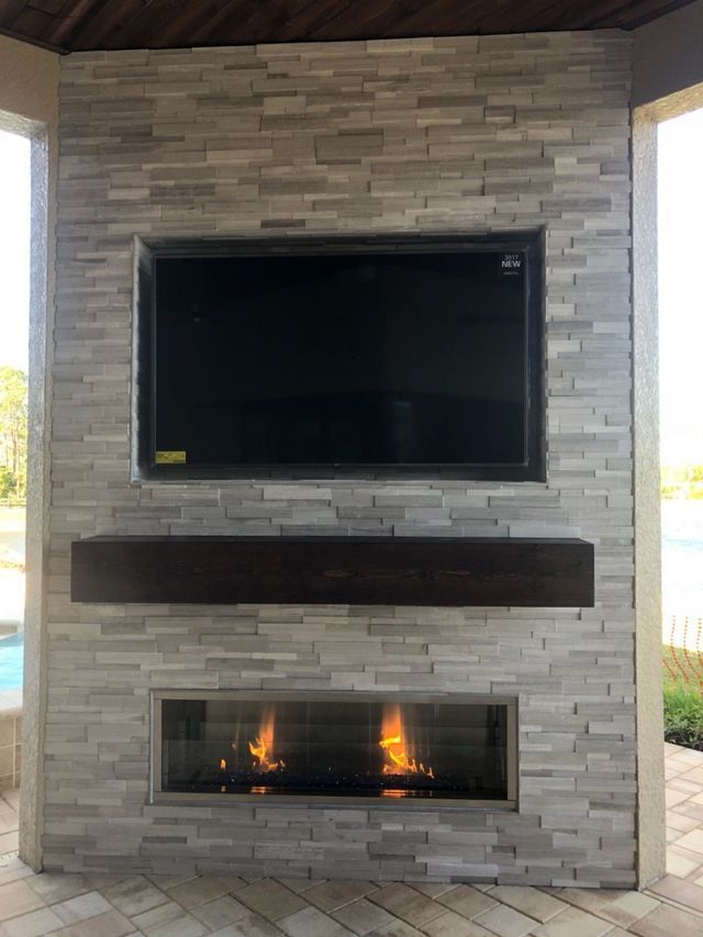 linear fireplace with mantle and tv feature wall estero, fl