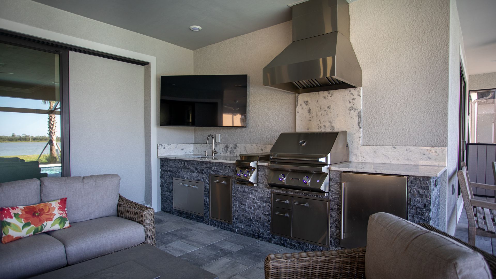 Stacked Stone Outdoor Kitchen Granite Backsplash Fridge Delta Heat Grill Hood Naples, FL