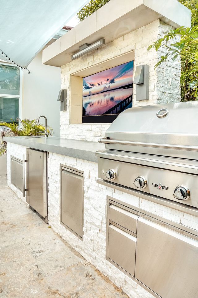 ledge stone outdoor kitchen with delta heat bbq grill naples, fl