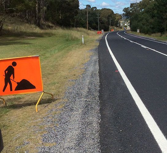A Road With A Construction Sign On The Side Of It - NSW - Midwest Traffic Management