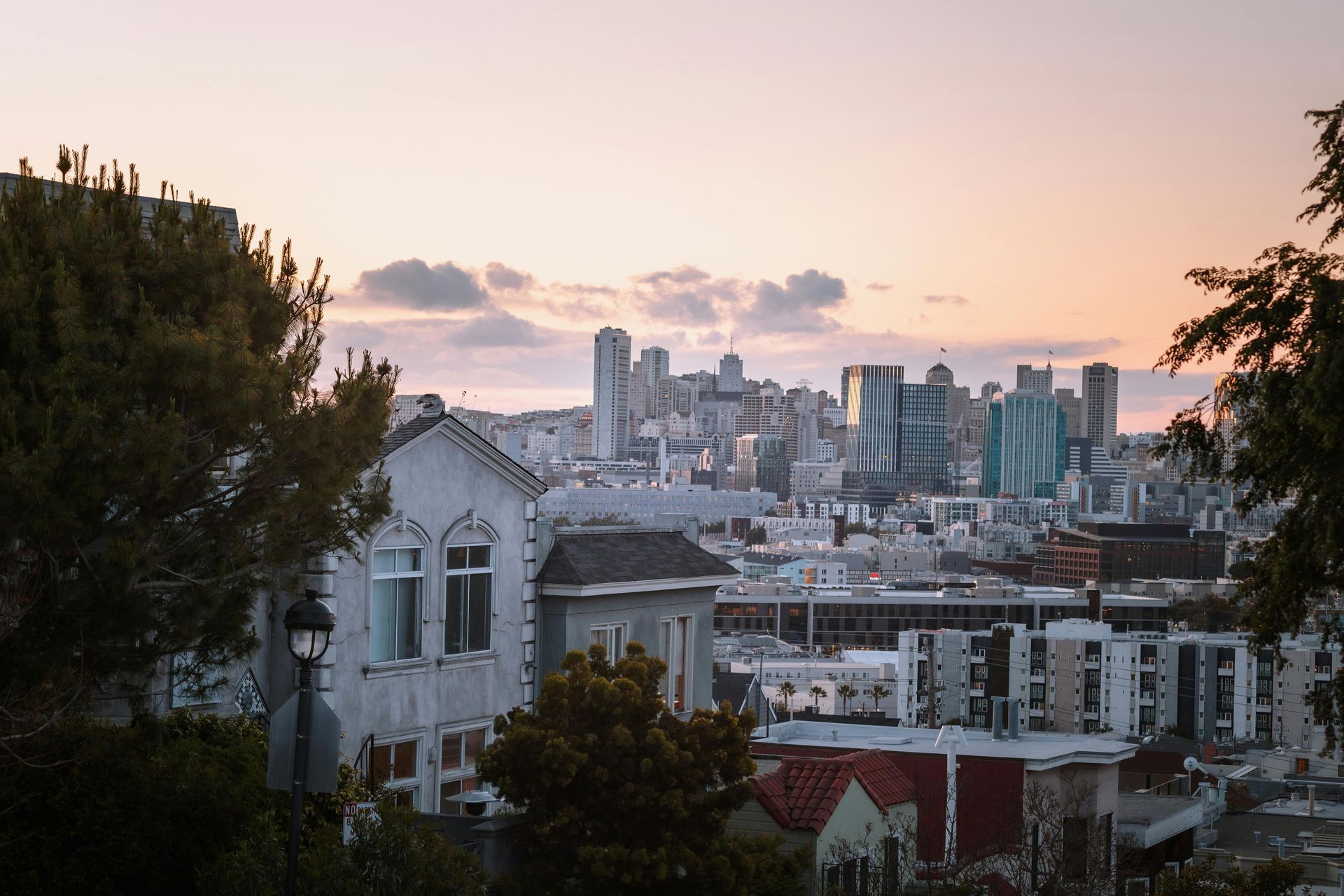 An aerial view of a city skyline at sunset.