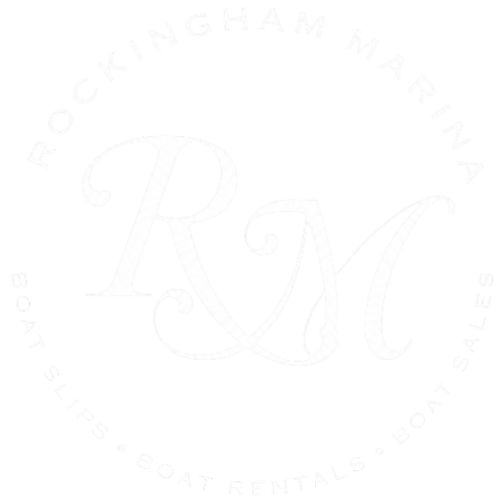 Faint circular logo with decorative “RM” monogram and surrounding text on a white background