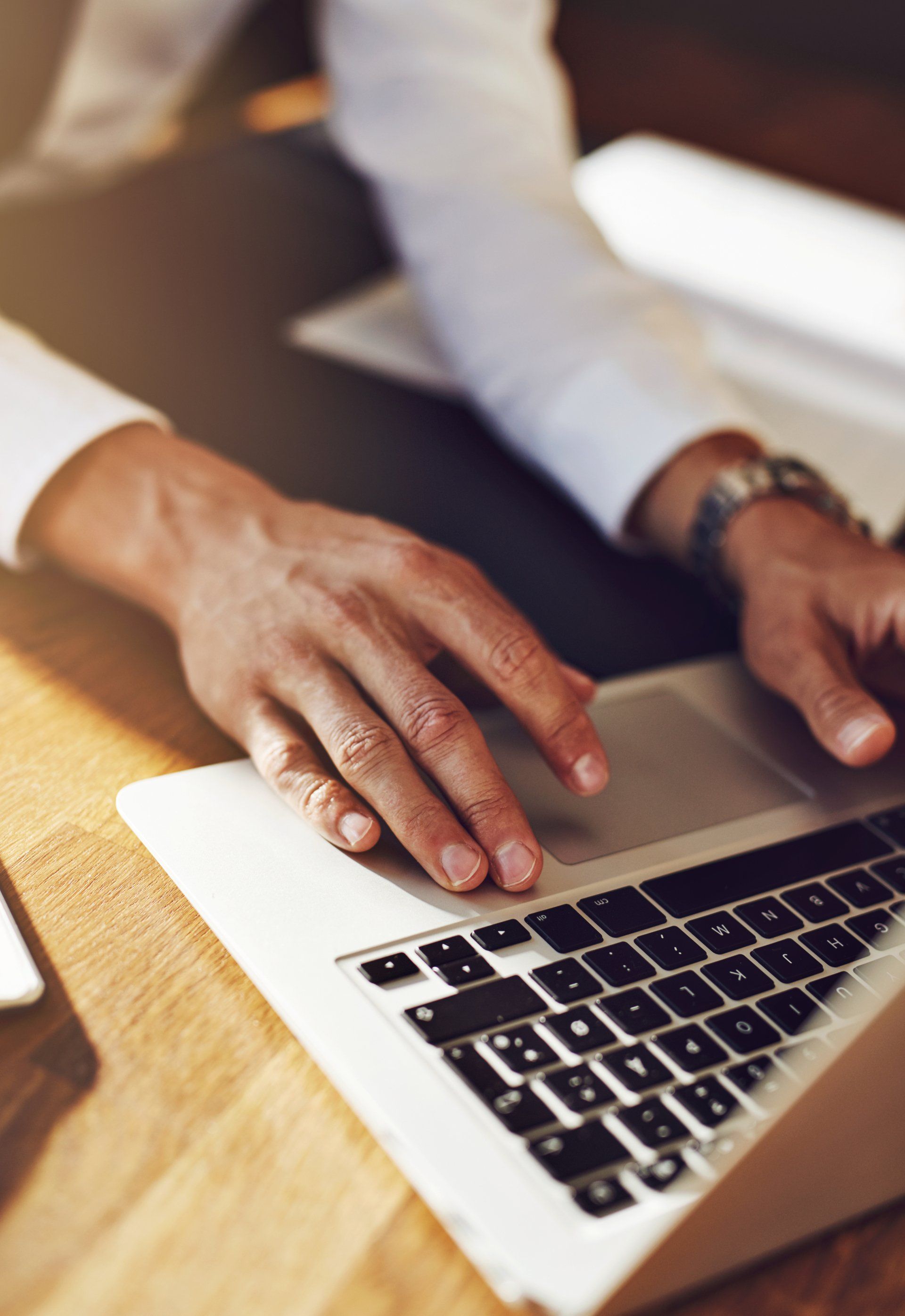 man typing on computer