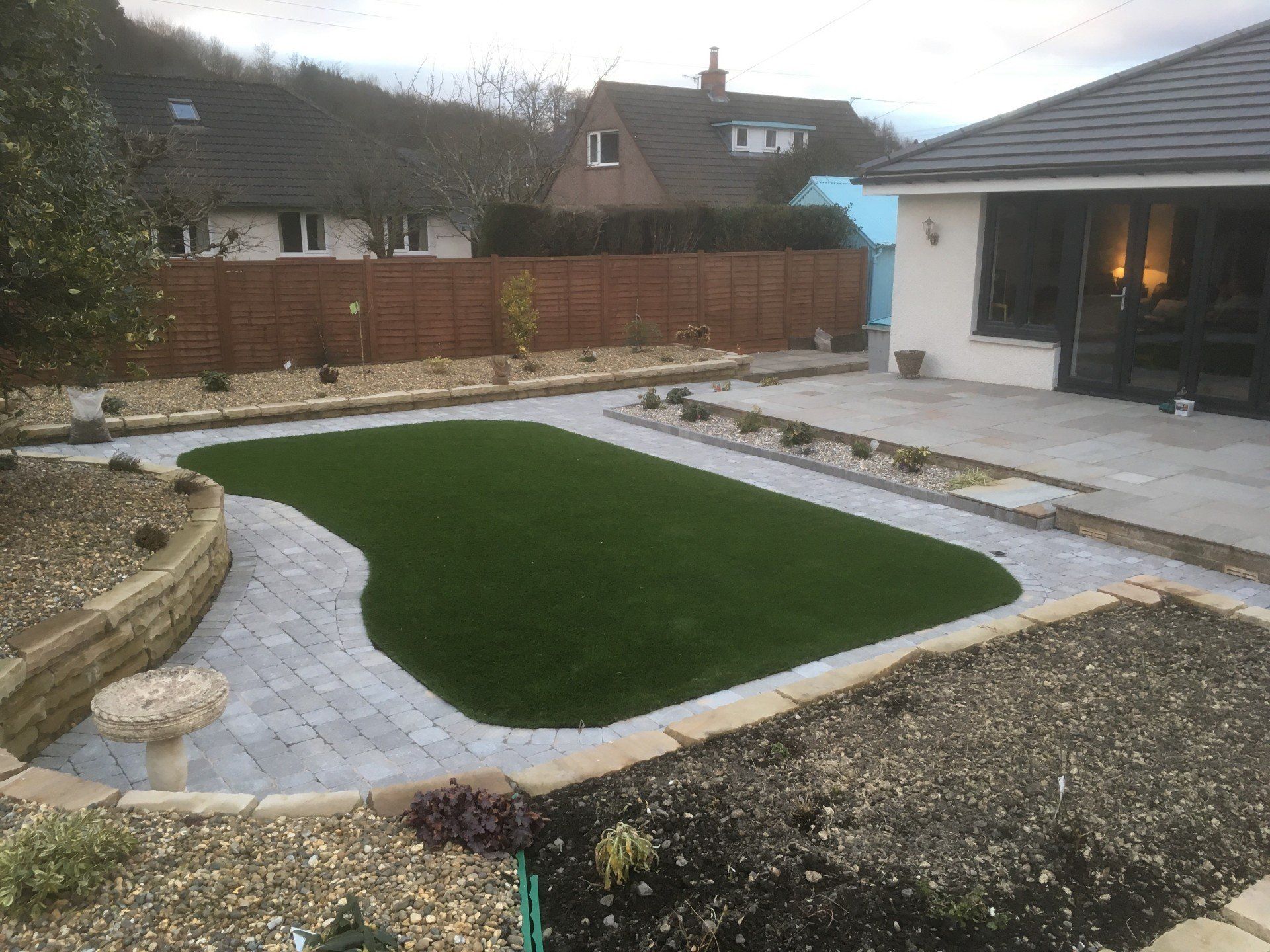 Garden with grassed area, soil and patio