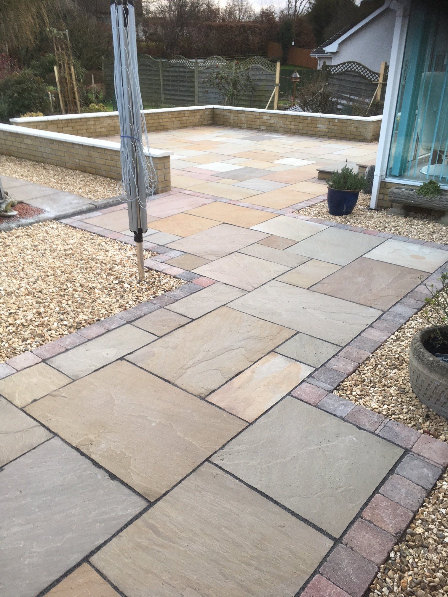 Patio slabs and gravel area in garden