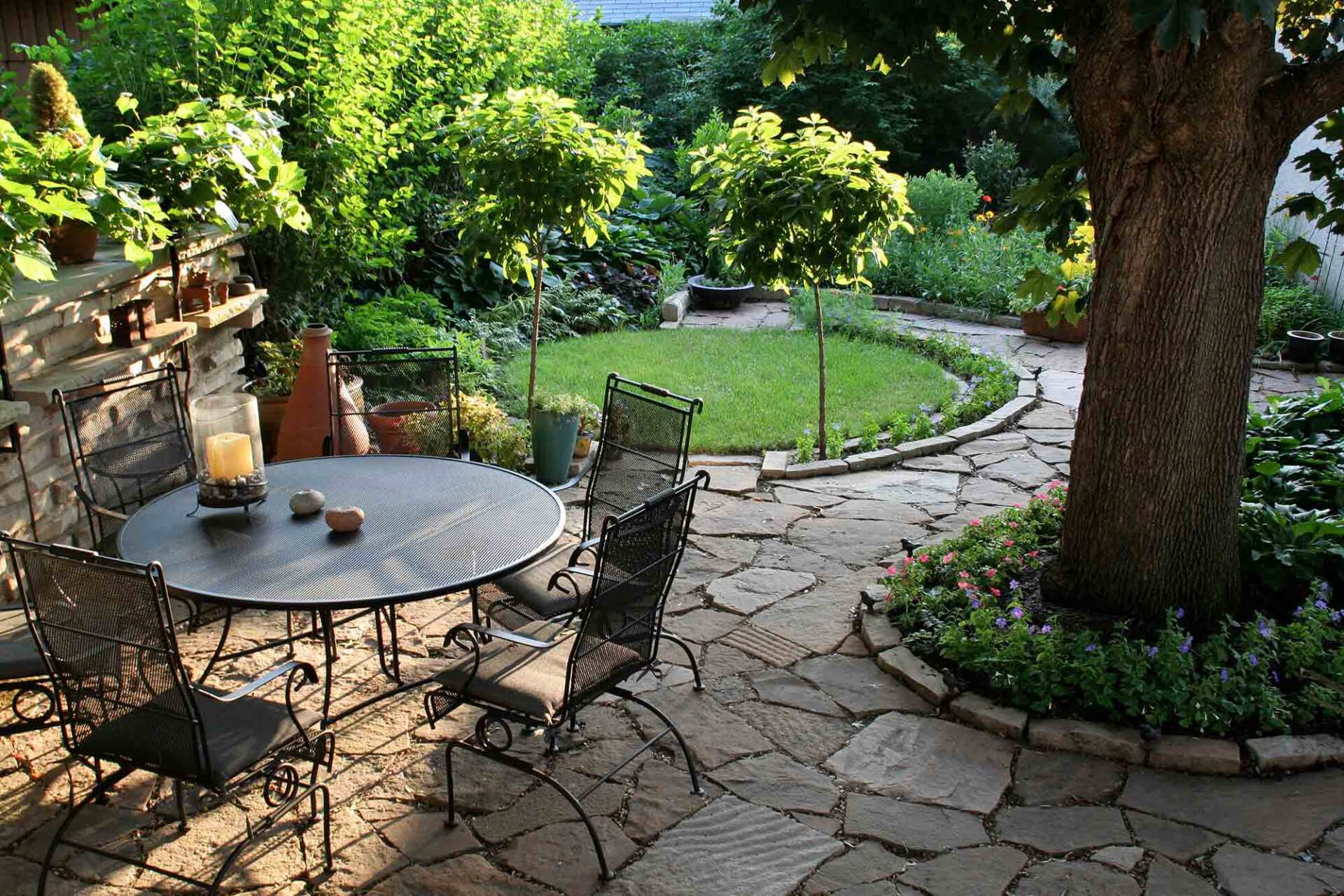 A garden and patio in the warm afternoon sun