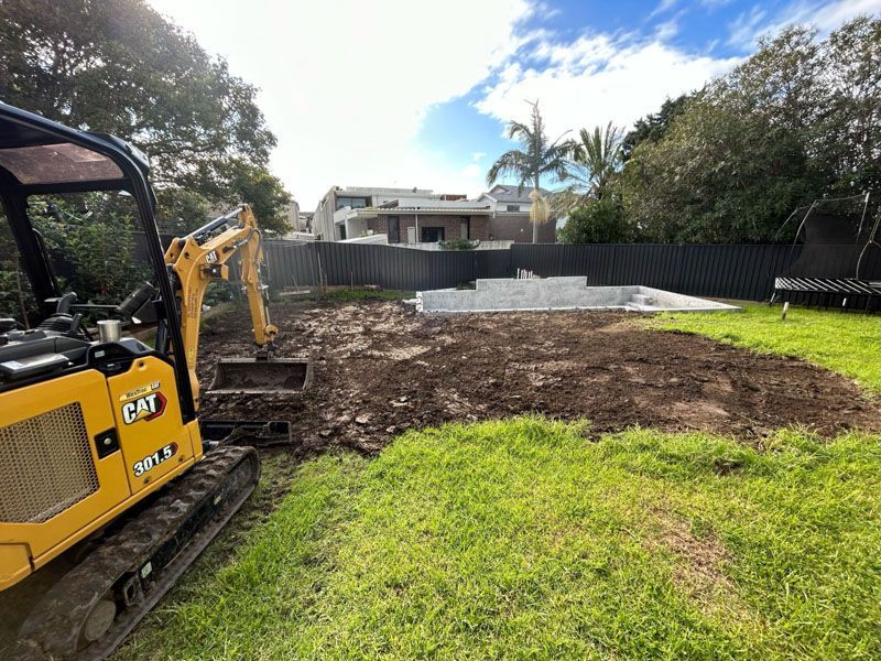 Caterpillar 301-5 Excavator conducting a pool dig-out