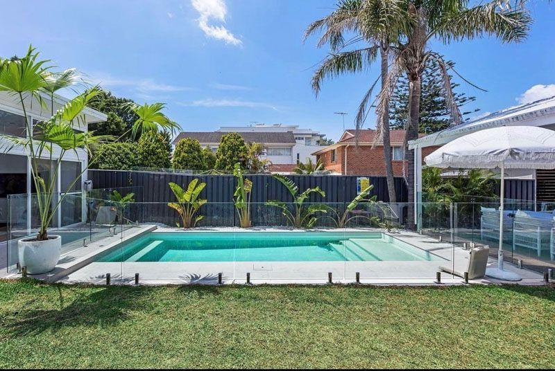 Residential pool with glass fencing