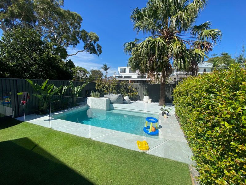 Residential pool with glass fencing