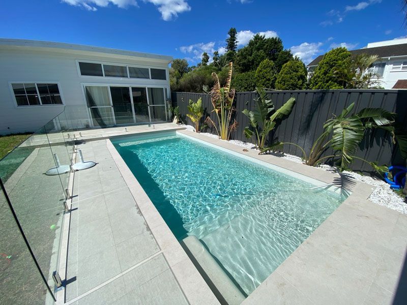 Residential pool with glass fencing