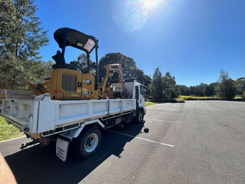 Caterpillar 301-5 Excavator on a tipper