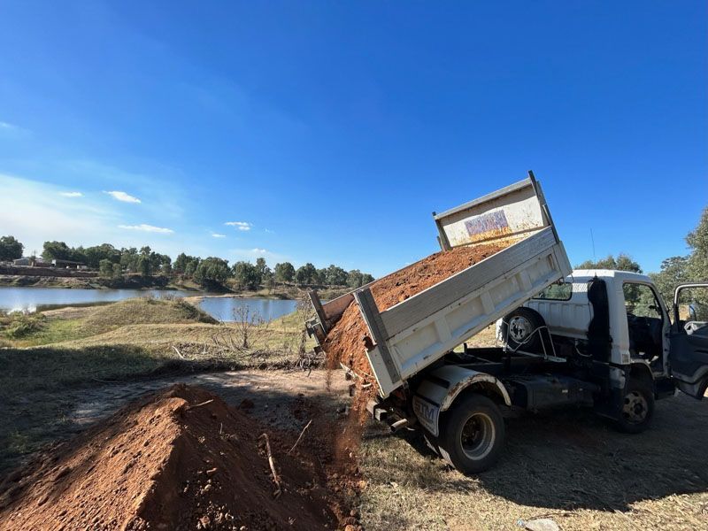 Tipper truck dumping dirt