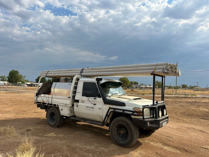 Landcruiser loaded with pipes