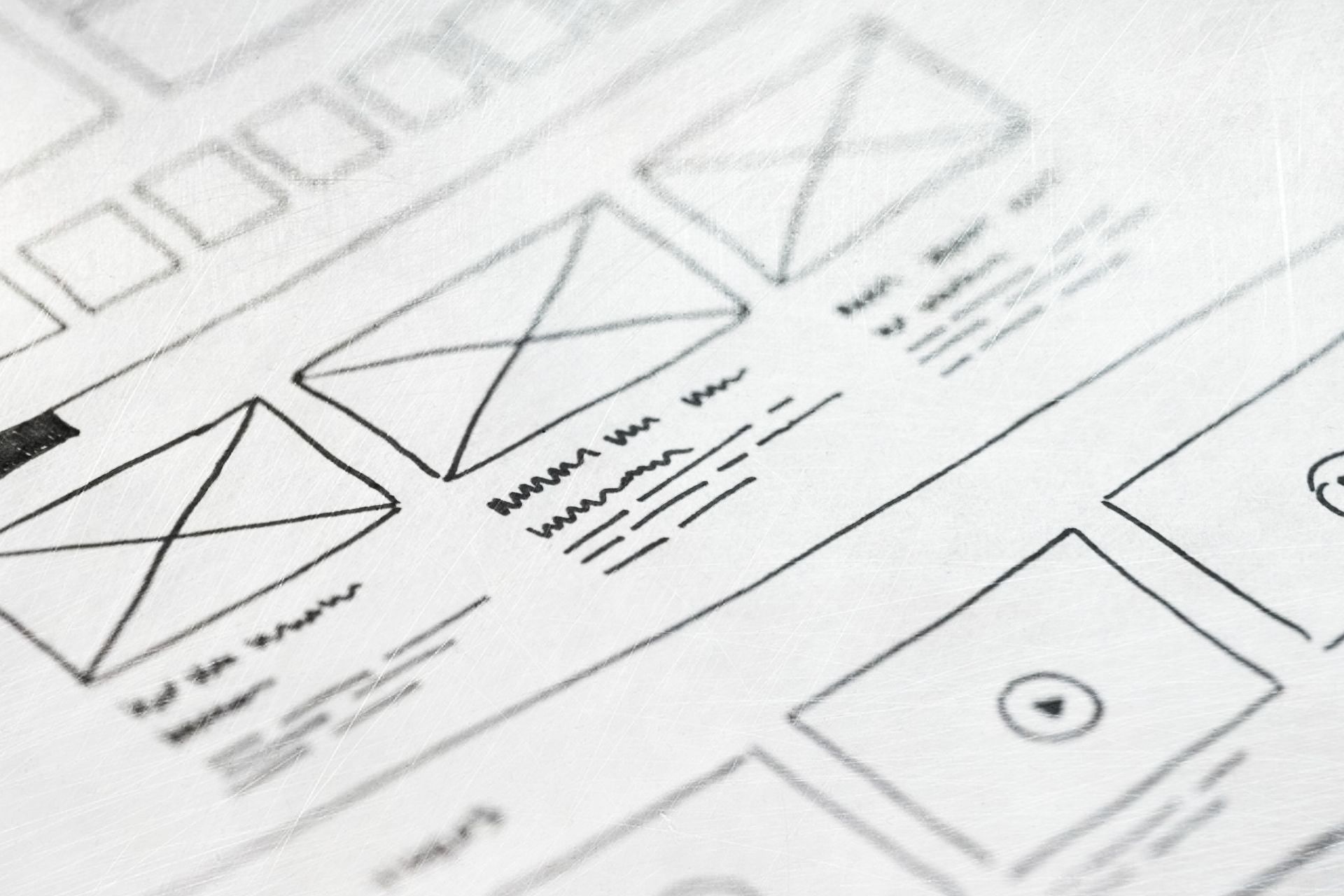 A close up of a website wireframe sketch on a piece of paper