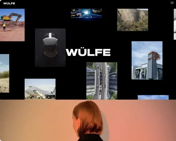 A woman stands in front of a wall with pictures and the word wulfe on it