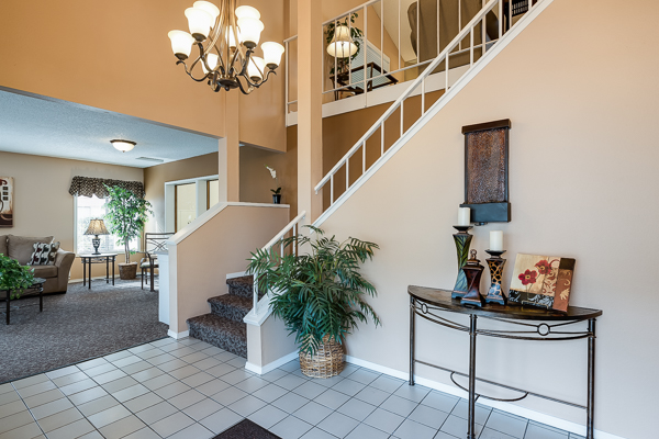 Photo of an entrance to a large building, showing stairs