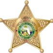 Hendry County Sheriff's Office star-shaped badge with state seal, gold and green, inscription: