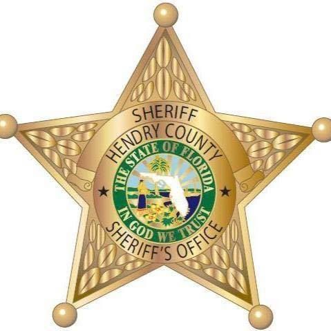 Hendry County Sheriff's Office star-shaped badge with state seal, gold and green, inscription: