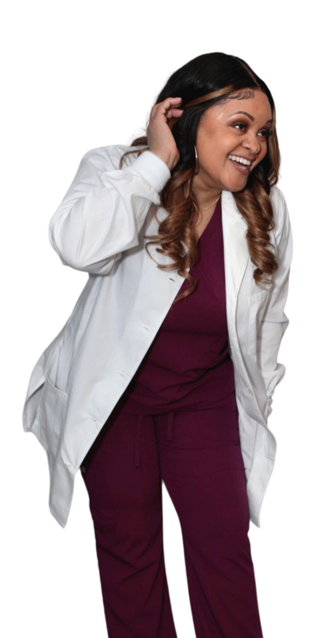 A woman in a lab coat and purple scrubs is smiling.