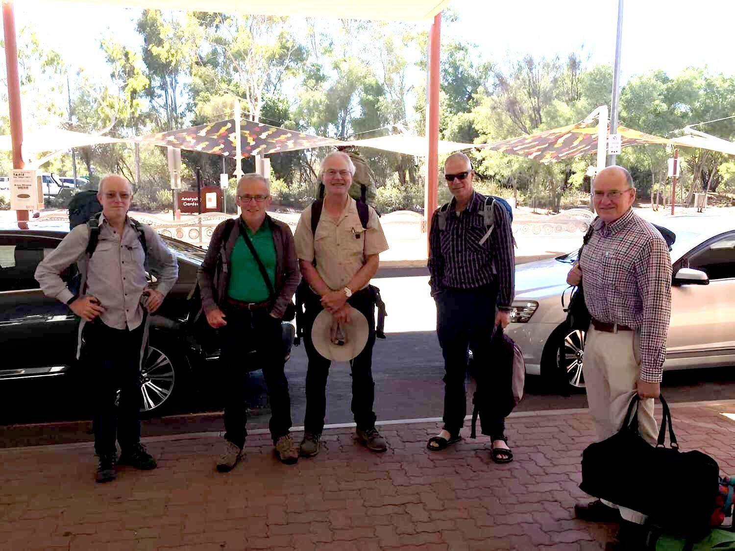 A Group Of Men Standing Next To Each Other In Front Of A Car — A & P Private Hire In Sadadeen, NT