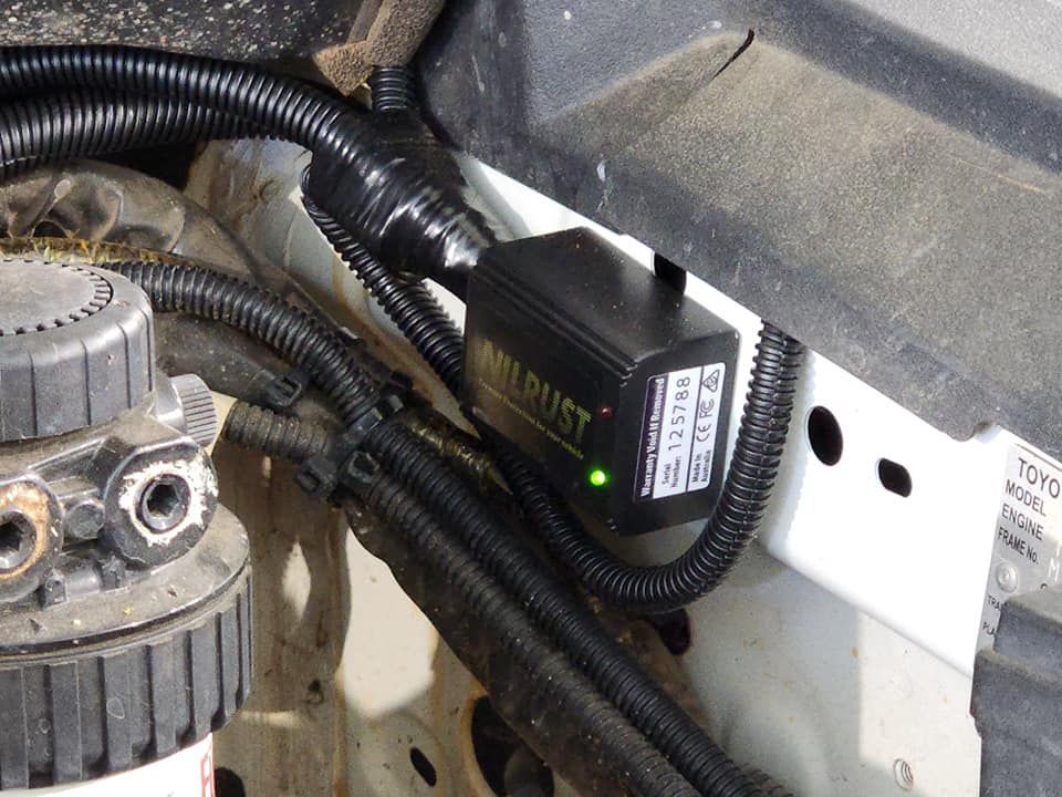 A Device That Says Nilrust on It is Attached to a Car — Ace Tinting In Cairns, QLD