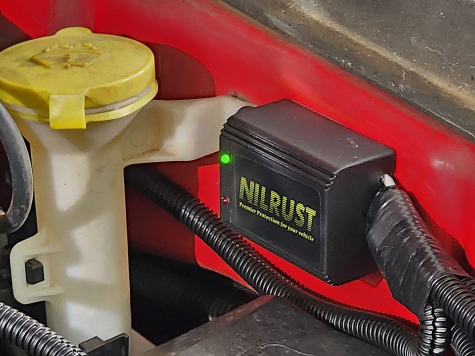 A Nilrust Device is Attached to the Hood of a Car — Ace Tinting in Mareeba, QLD