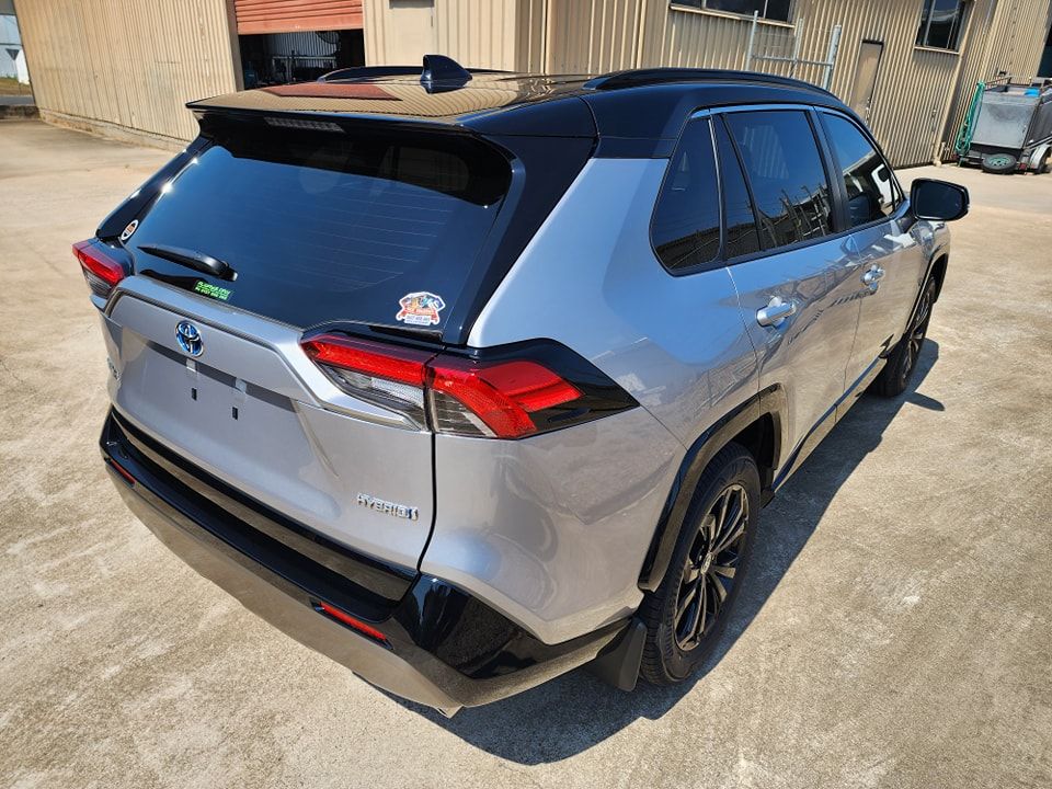 A Silver Toyota RAV4 is Parked in a Parking Lot in Front of a Building — Ace Tinting in Mareeba, QLD