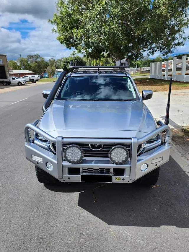 A Silver Truck is Parked on the Side of the Road — Ace Tinting In Innisfail, QLD