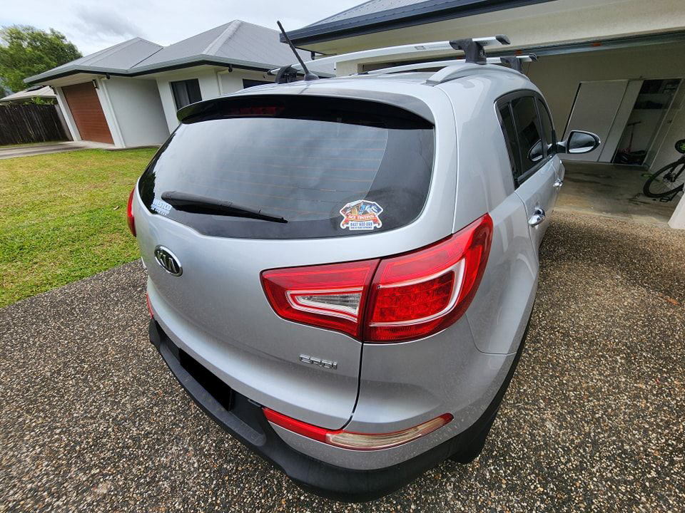 A Silver Car is Parked in Front of a House — Ace Tinting In Cairns, QLD