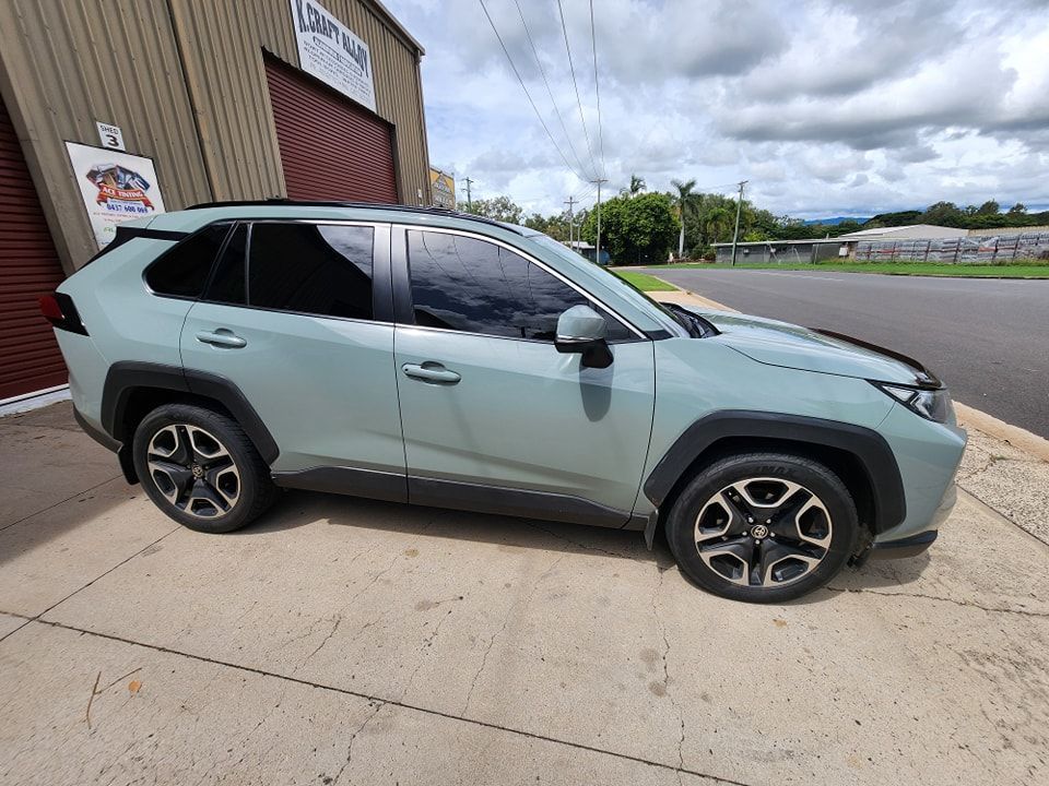 A car is parked on the side of the road in front of a building — Ace Tinting in Mareeba, QLD