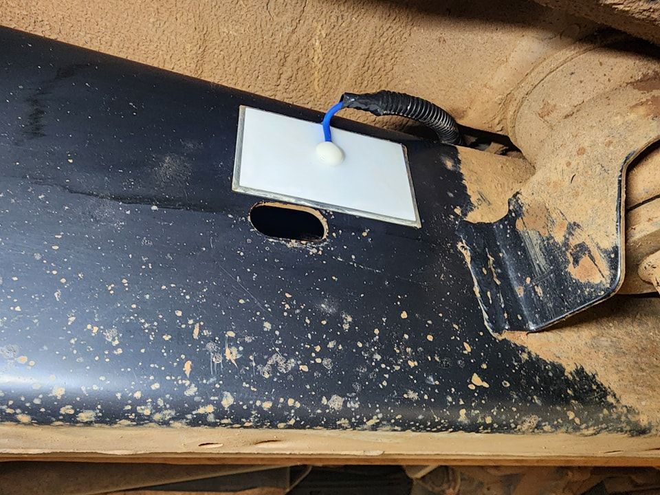 A piece of metal with a white sticker on it — Ace Tinting in Mareeba, QLD