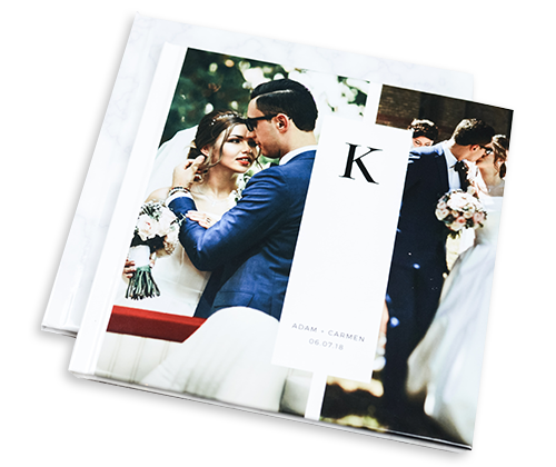a bride and groom are kissing on the cover of a wedding album .
