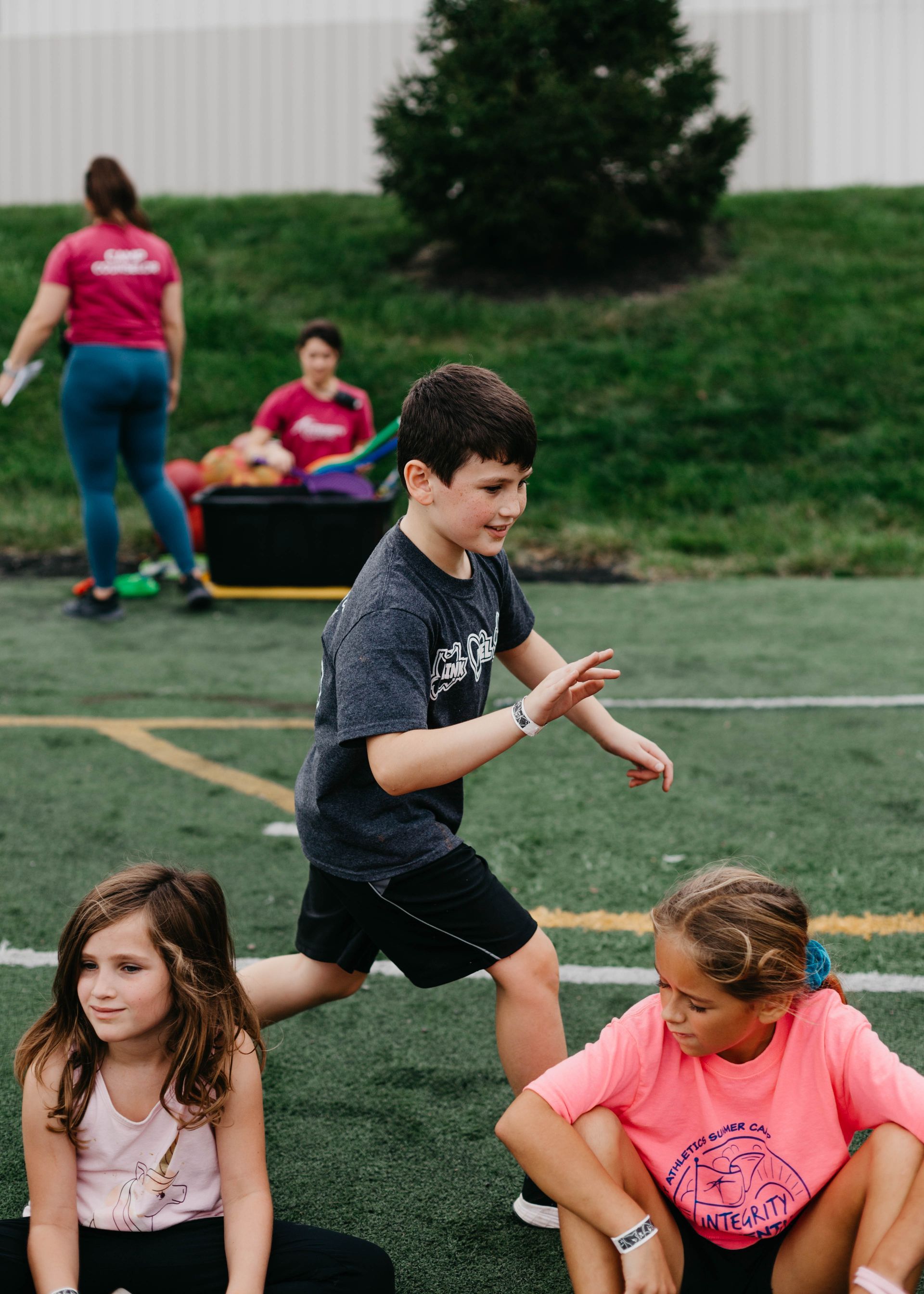 A group of children are playing on a field.