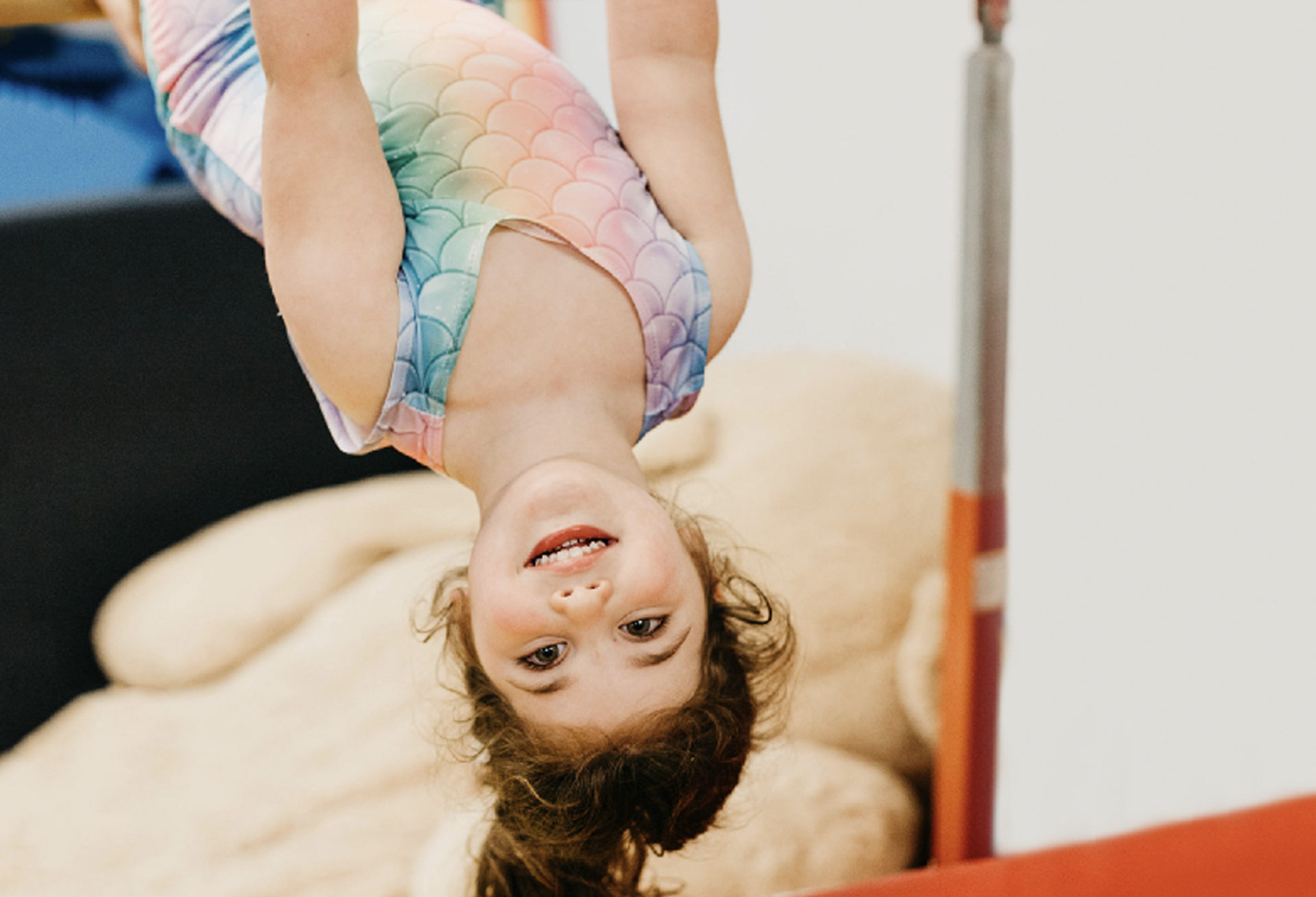 Child playing on gym equipment