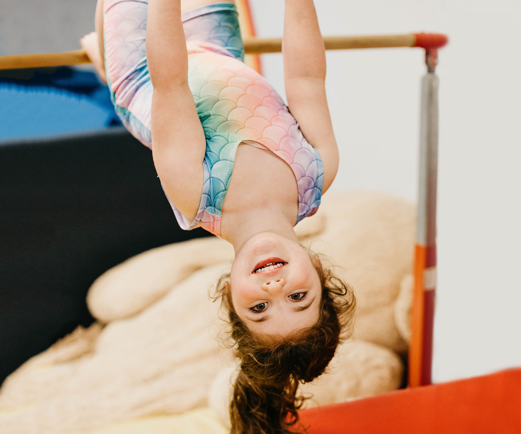 Child playing on gym equipment