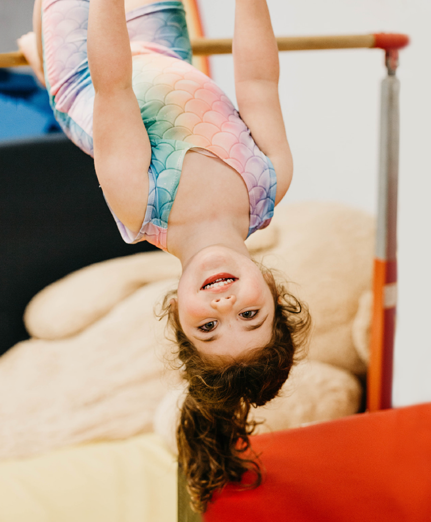 Child playing on gym equipment