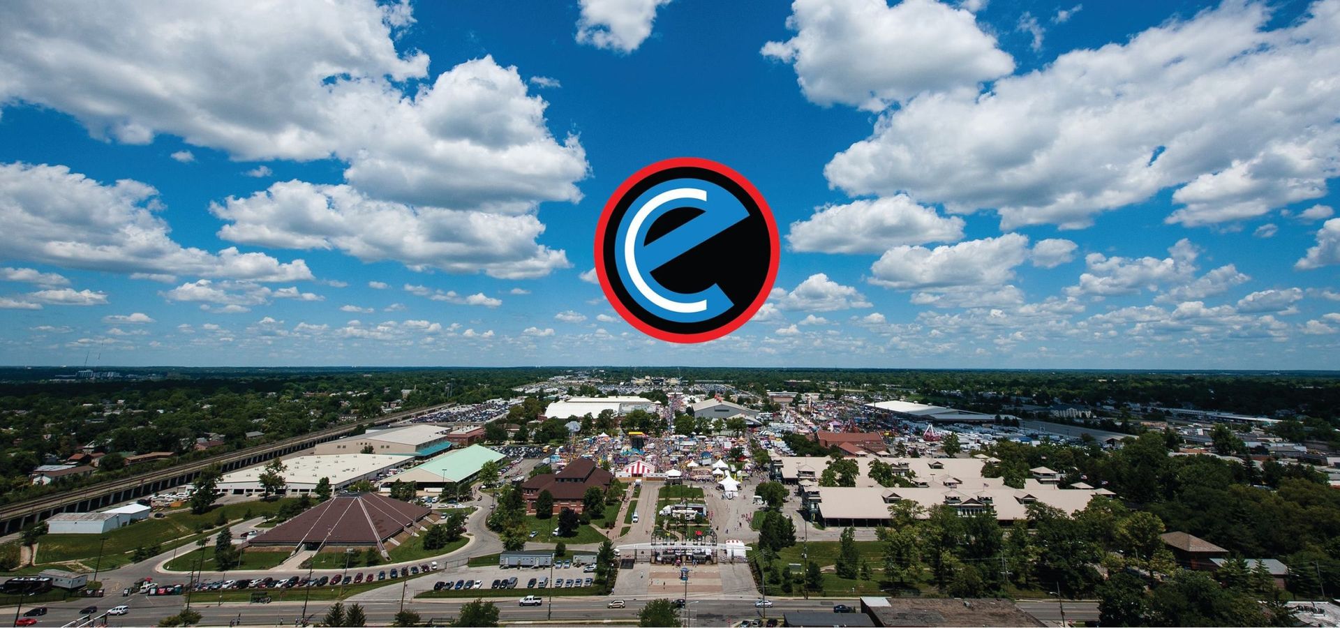 An aerial view of a small town with a large e in the sky.