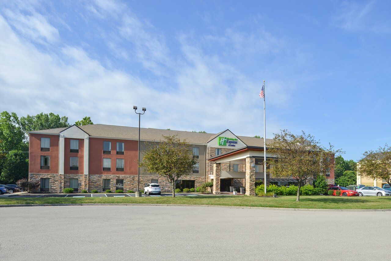 A large hotel with a flag in front of it