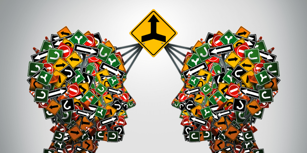 Two heads made out of traffic signs are talking to each other.