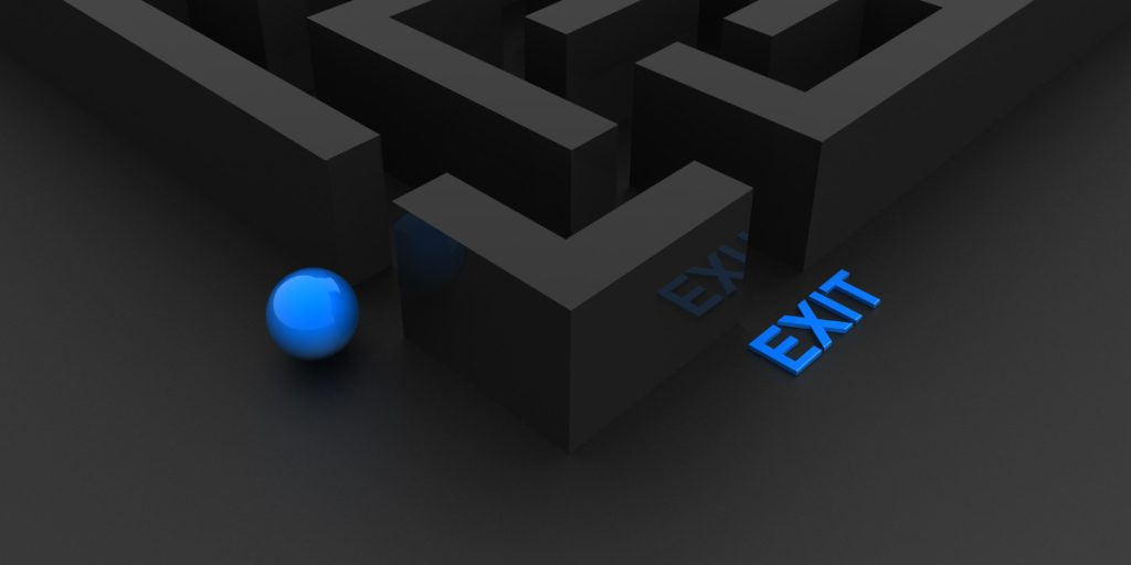 There is a blue ball in the middle of a maze.