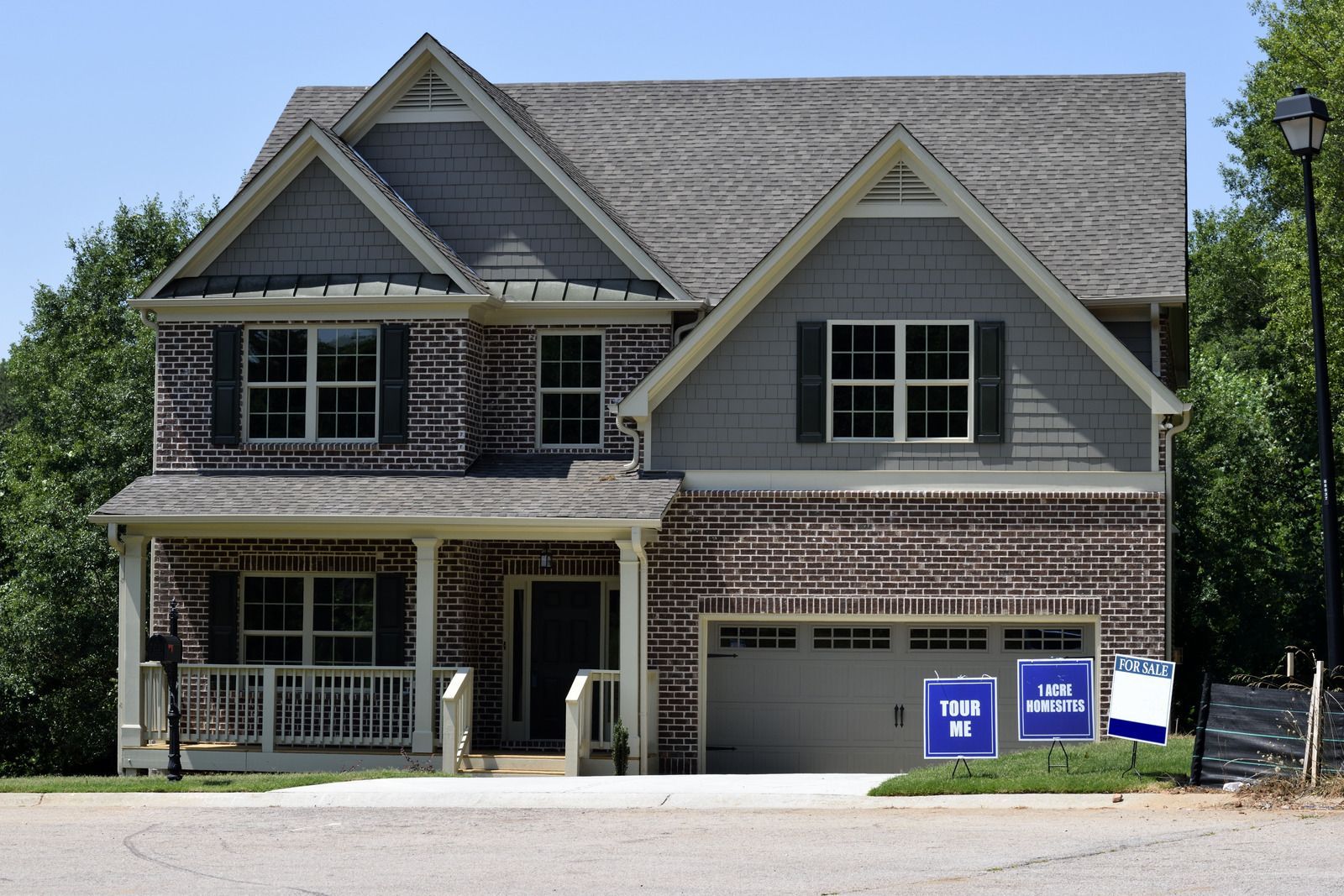 A large house with a lot of windows and a garage