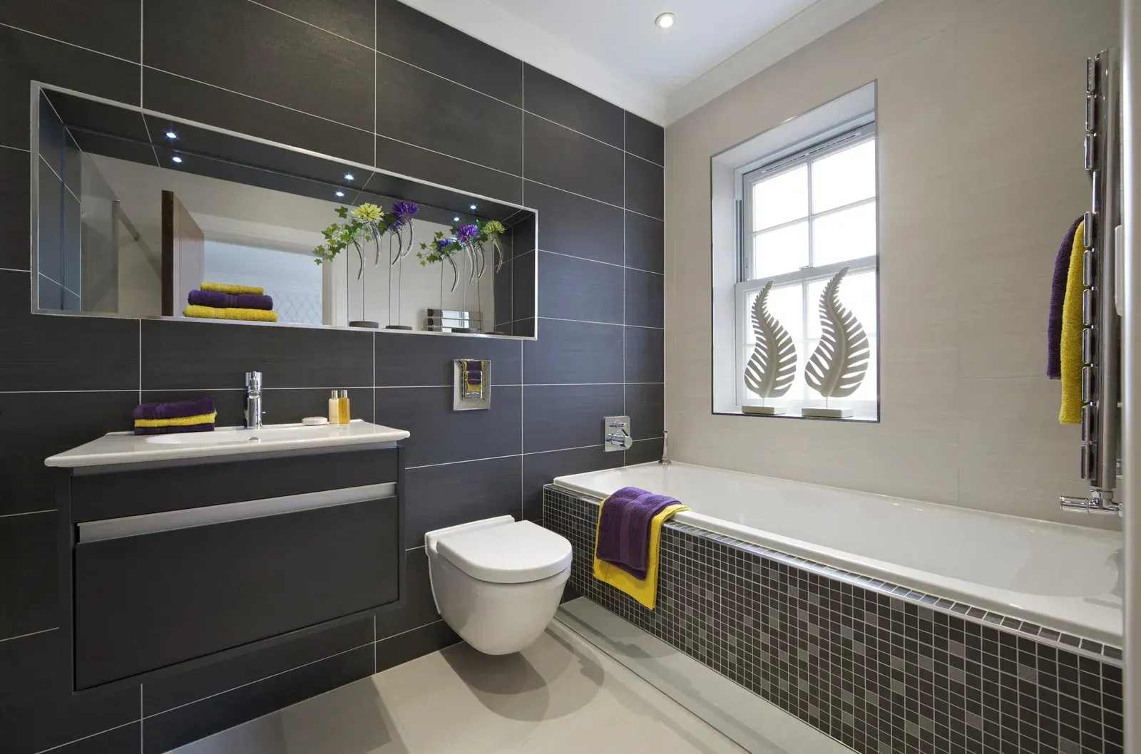 A bathroom with a toilet a sink and a window