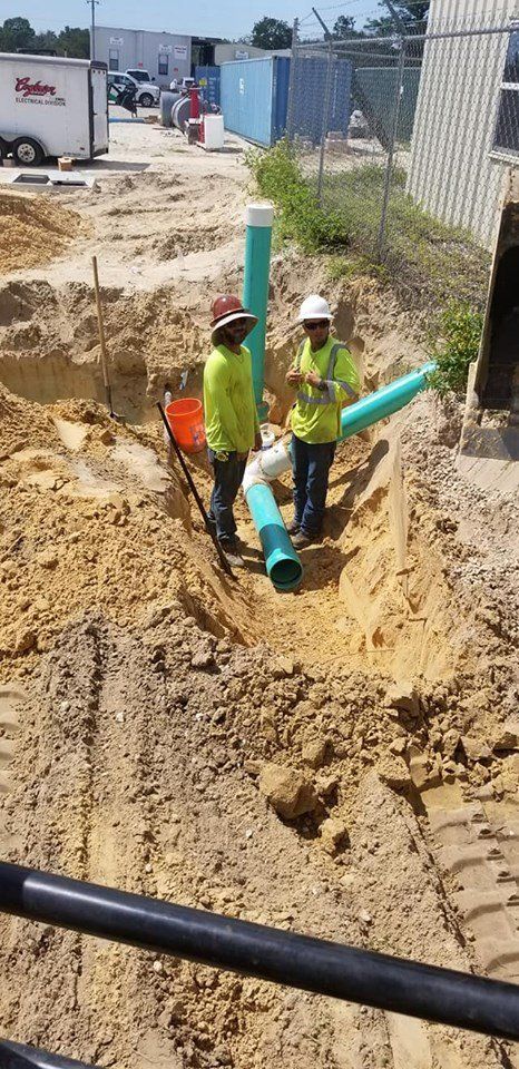 Construction — Two Man Working a Pipe in Spring Hill, FL