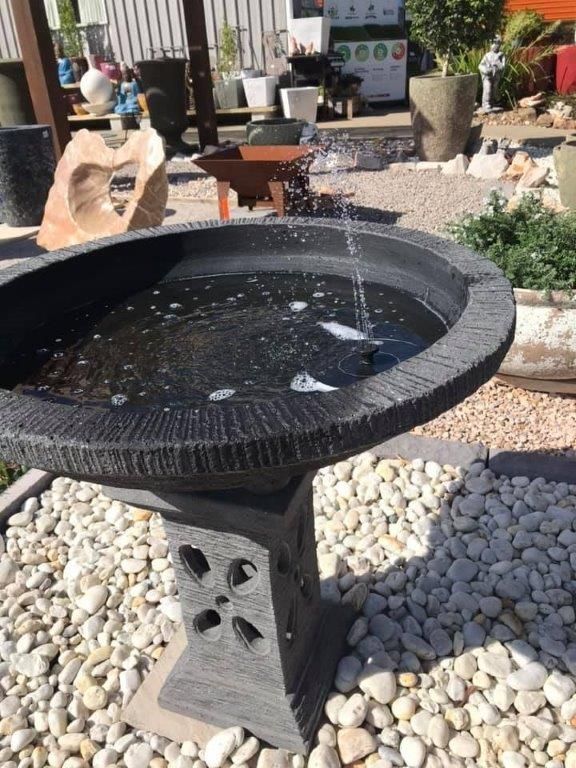 A Bird Bath Is Surrounded by Rocks and Water — Cooroy Landscape Supplies and Garden Centre in Cooroy, QLD