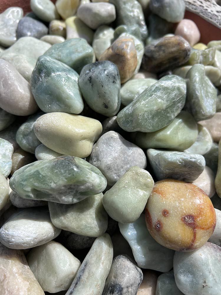 A Close Up Of A Pile Of Pebbles In A Bowl — Cooroy Landscape Supplies and Garden Centre in Noosa, QLD