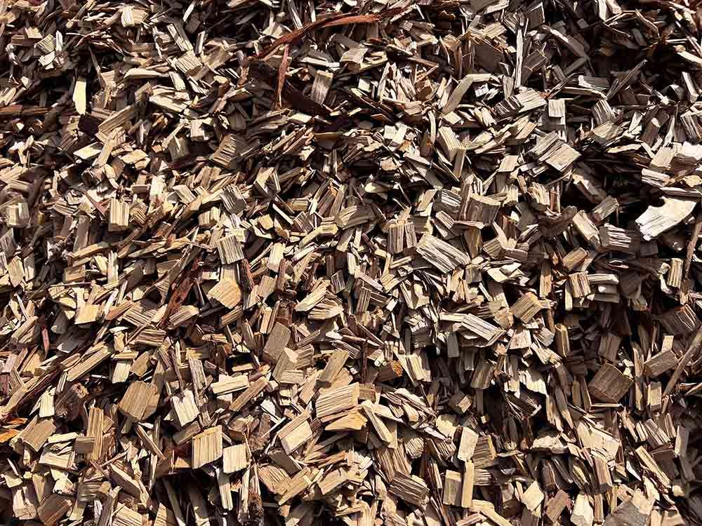 A Pile Of Wood Chips Is Sitting On The Ground — Cooroy Landscape Supplies and Garden Centre in Eumundi, QLD